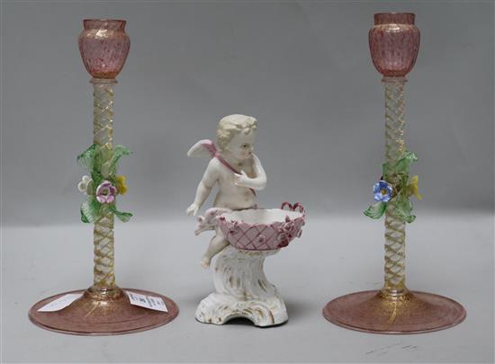 A pair of Venetian glass candlesticks and a Continental porcelain cherub